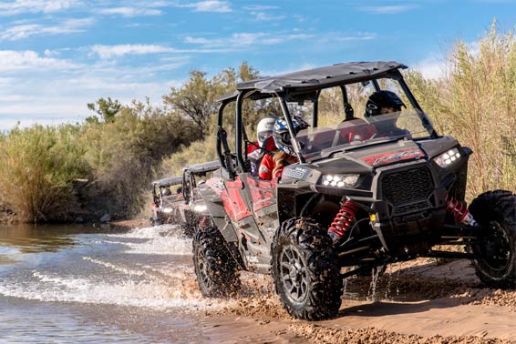Adventurous guests enjoying off-road vehicle tours through rugged terrain at Pirate Cove Resort.