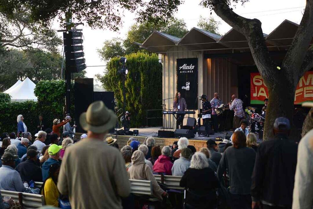 Crowd enjoying a live performance at the Monterey Jazz Festival, highlighting the festival's vibrant atmosphere and community engagement