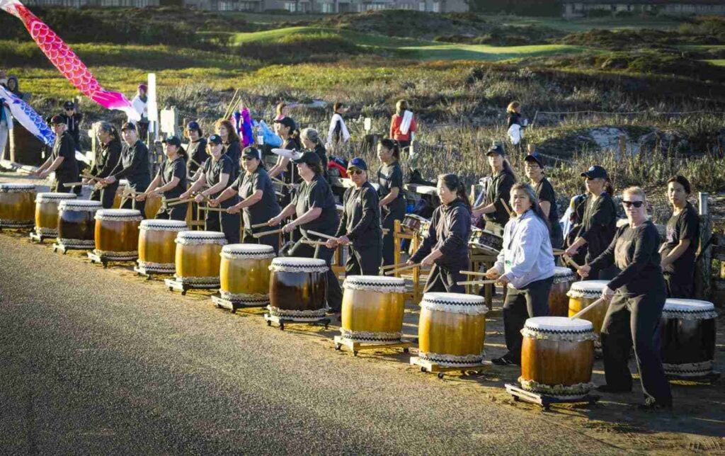 Energetic taiko drummers performing at the Monterey Bay Half Marathon, invigorating runners and spectators.