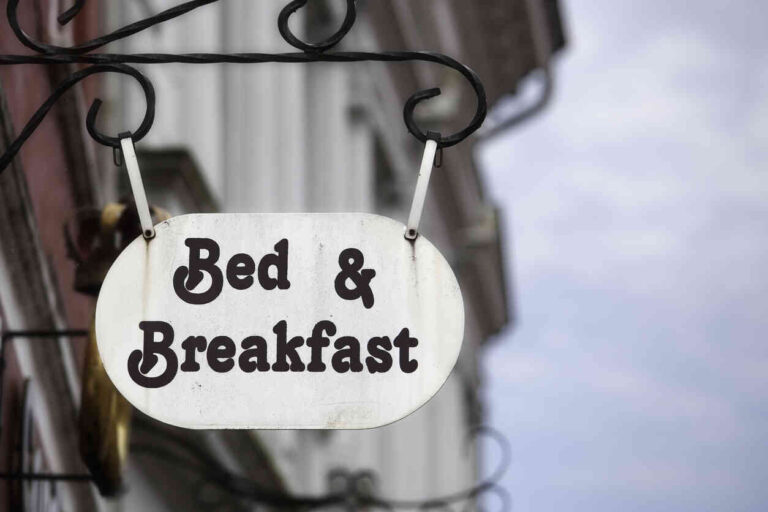 bed and breakfast in Monterey, Bed and Breakfast sign on building facade.